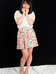 Cheerful teen Reo Saionji posing seductively in her stockings and stylish heels