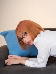 Glasses-wearing secretary Chie Kobayashi flashing her pussy on a couch