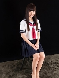 Schoolgirl seductress Aino Neko casually jerking a cock with her soft feet