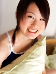 Naoko Sawano in swimsuit puts pillow between her sexy legs