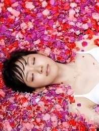 Airi Suzuki in bath suit enjoys petals all over her body