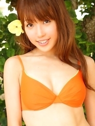 Nozomi Kawasaki is naughty and spreads legs on the beach