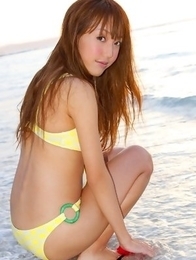Nozomi Kawasaki in yellow bath suit enjoys the sun and sea